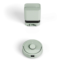 iRobot Roomba Mini przed stacją bazową AutoEmpty, minimalistyczny design, średnica 24,5 cm