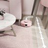 iRobot Roomba Mini sprząta pod krzesłem w salonie dzięki kompaktowym wymiarom i mocy ssącej