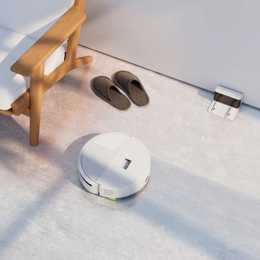 Roomba 205 sprząta wokół fotela