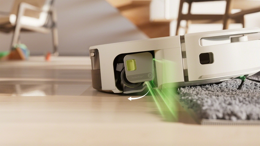 Robot Roomba Max 705 Combo wysuwa osłonę ochronną pod wałkiem mapującym po wykryciu dywanu w salonie