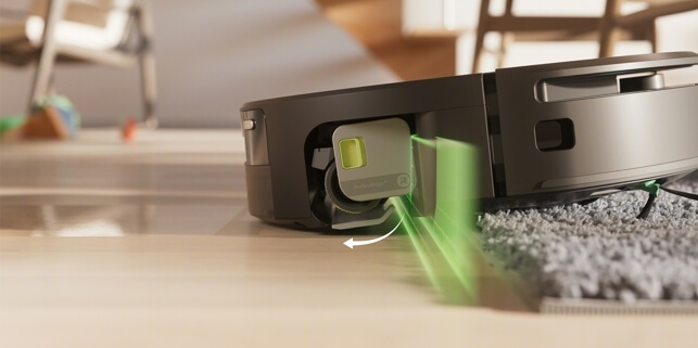 Robot Rooma Max 705 Combo wysuwa osłonę ochronną pod wałkiem PowerSpin po wykryciu dywanu w salonie