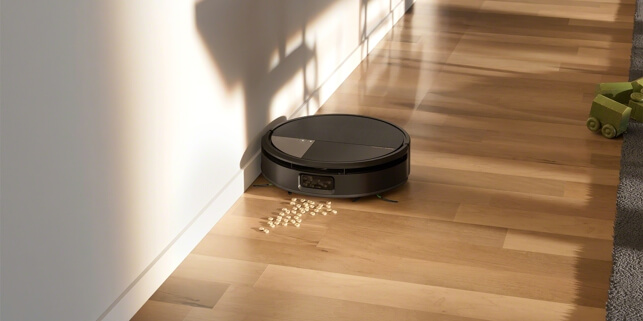 Robot Roomba Max 705 Combo odkurza okruszki wzdłuż listwy przypodłogowej na panelach