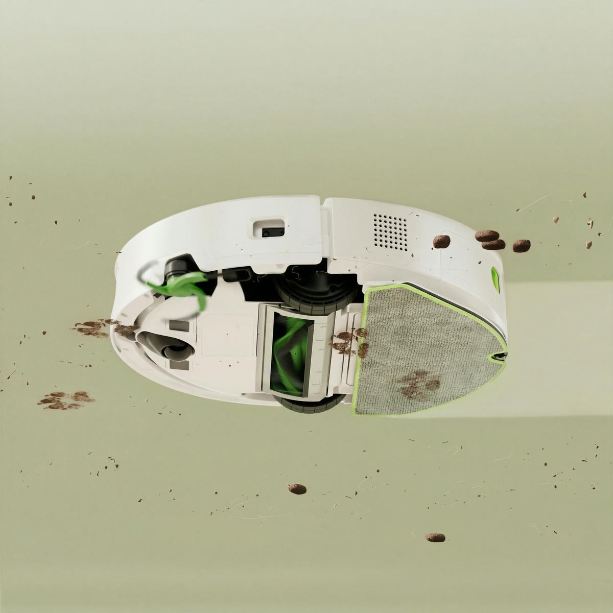Widok od spodu robota Roomba 115, który jednocześnie odkurza i&nbsp;mopuje podłogę