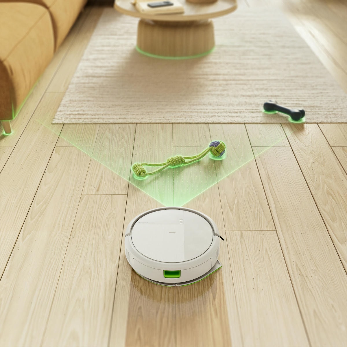 Robot Roomba sprząta panele w&nbsp;salonie wykrywając psie zabawki na swojej drodze