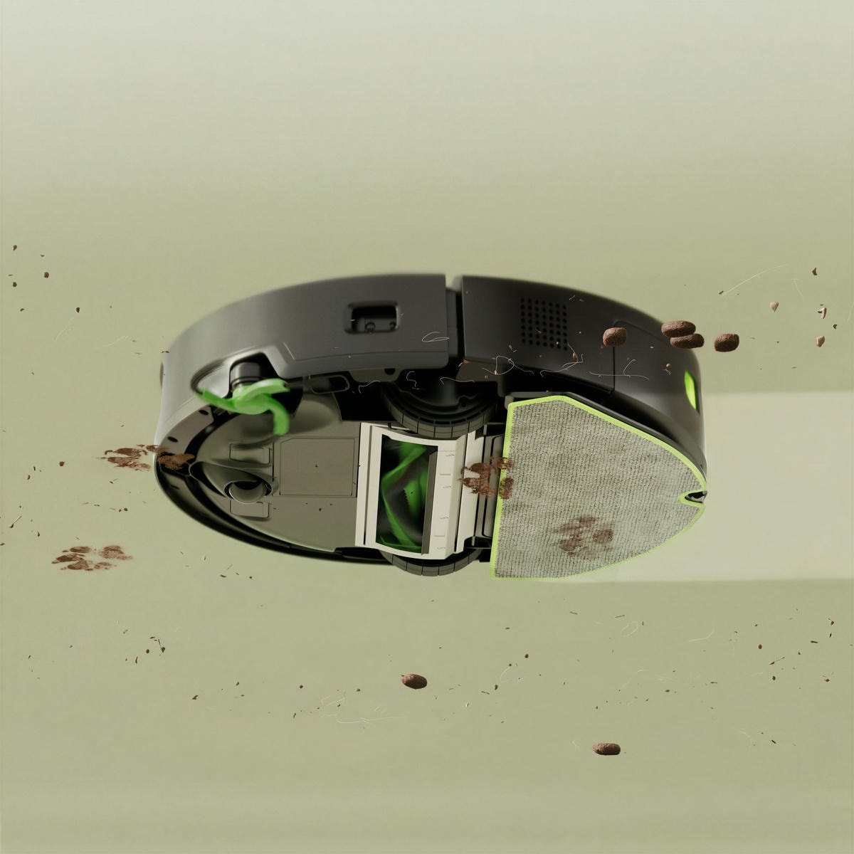 Widok od spodu robota Roomba 115, który jednocześnie odkurza i&nbsp;mopuje podłogę