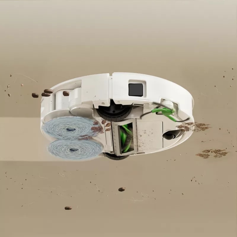 Robot Roomba 415 pokazany od spodu jednocześnie odkurza i mopuje twardą podłogę