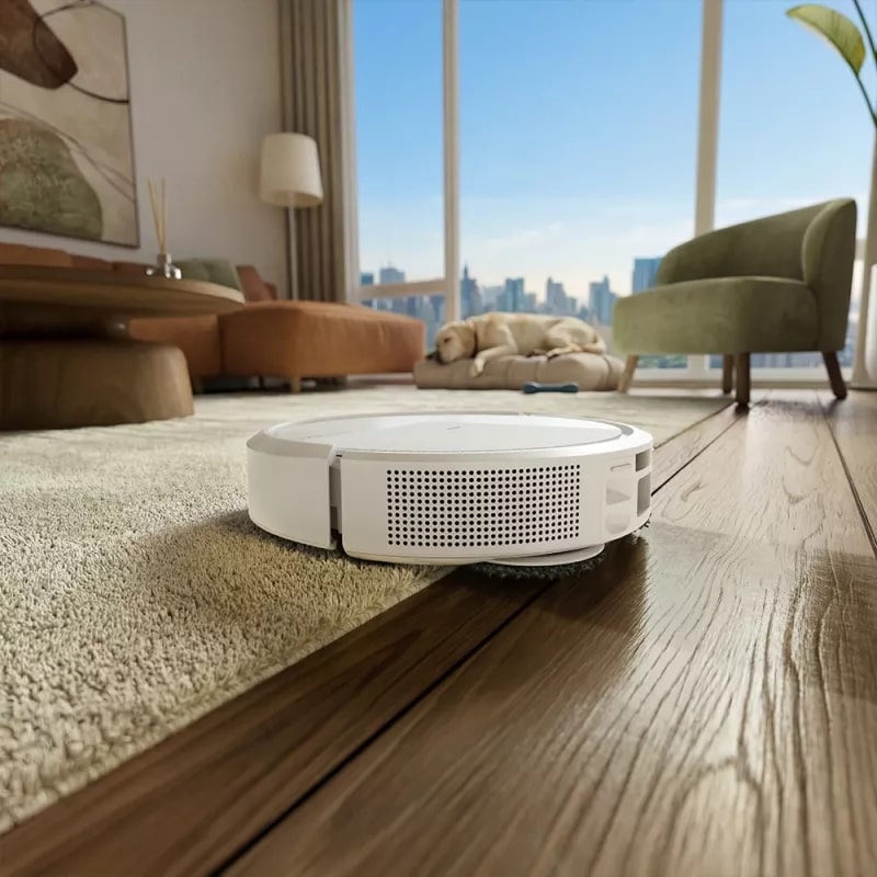 Robot Roomba 515 Combo unosi pady mopujące wjeżdżając na dywan w salonie